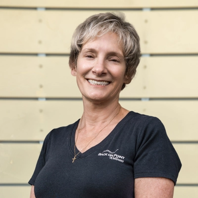 Transformational Life Coach Torrance CA Gayle Ferruccio 1 Gayle Ferruccio smiling in a grey shirt.