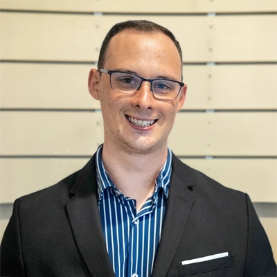 Transformational Life Coach Torrance CA Reed Barnard Reed Barnard smiling in a suit.